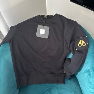 Moose Knuckles Black Crewneck Sweater with Gold Logo Patch